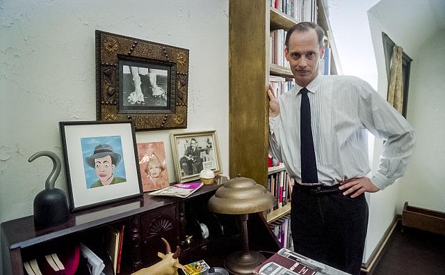 John Waters, film producer/director, in his home.