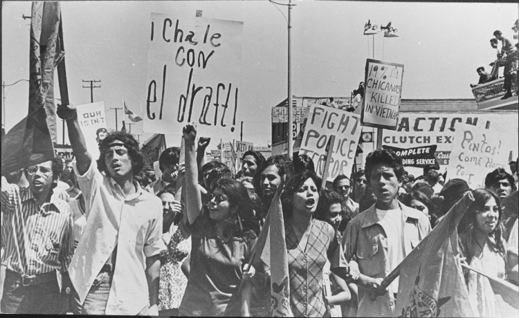 Protesters marching on Whittier Boulevard at the National Chicano Moratorium Anti-Vietnam War March, August 29, 1970 in Los Angeles